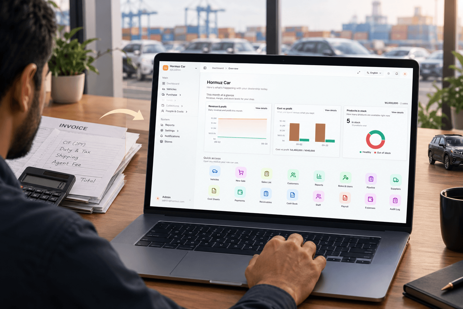 A dealership operator at a desk with paper invoices and a calculator on one side, and Hormuz Car open on a laptop showing live stock, cost, and profit.